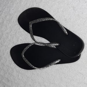 Silver and black flip flops